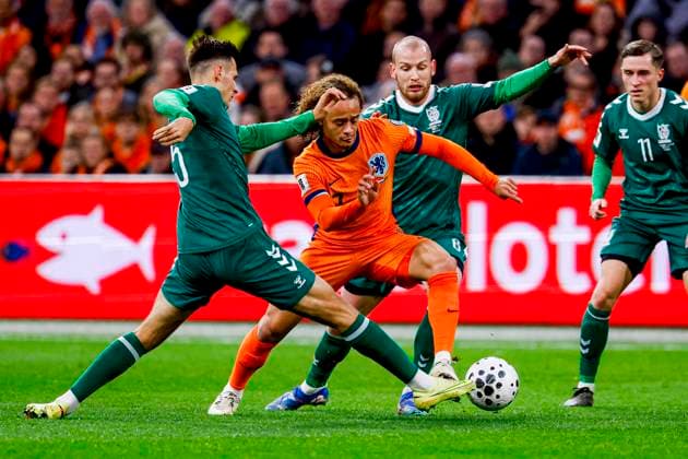 Xavi Simons of the Netherlands dribbles with the ball under pressure from Gvidas Gineitis of Lithuania Netherlands v Lithuania, FIFA World Cup, WM, Weltmeisterschaft, Fussball 2026 Qualifier, Netherlands v Lithuania, Johan Cruijff Arena, November 17, 2025, Amsterdam, Netherlands.