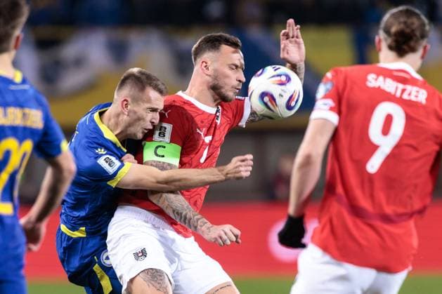 SOCCER - FIFA WC quali, AUT vs BIH VIENNA,AUSTRIA,18.NOV.25 - FIFA World Cup, WM, Weltmeisterschaft, Fussball 2026, European Qualifiers, group stage, OEFB international match, Länderspiel, Nationalmannschaft Austria vs Bosnia and Herzegovina. Image shows Amar Memic (BIH) and Marko Arnautovic (AUT). GEPAxpictures xArminxRauthner