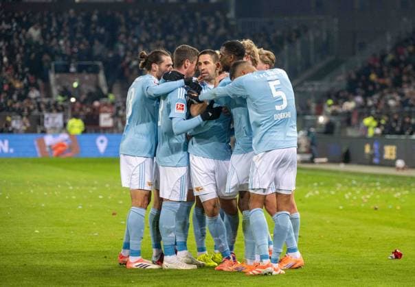 Football, Men, Season 2025 2026, 1 Bundesliga 11 Matchday , FC St Pauli 1 FC Union Berlin, f l Christopher Trimmel 1 FC Union Berlin , Andrej Ilic 1 FC Union Berlin , Rani Khedira 1 FC Union Berlin , Ilyas Ansah 1 FC Union Berlin , Danilho Doekhi 1 FC Union Berlin , Celebration after goal to 0 1, 23 11 2025, Copyright: xMatthiasxKochx