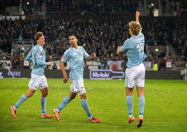Soccer, Men, Season 2025 2026, 1 Bundesliga 11 Matchday , FC St Pauli 1 FC Union Berlin, f l Aljoscha Kemlein 1 FC Union Berlin , Rani Khedira 1 FC Union Berlin , Tom Rothe 1 FC Union Berlin , Cheering after goal to 0 1, 23 11 2025, Copyright: xMatthiasxKochx
