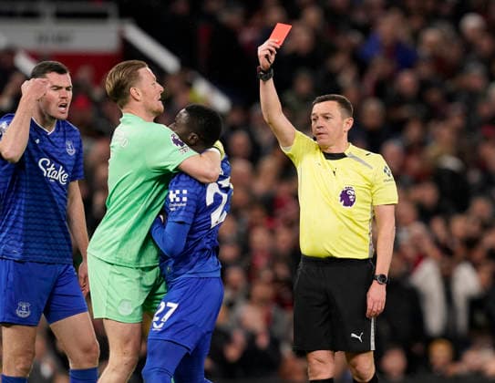 Manchester, England, 24th November 2025. Jordan Pickford of Everton holds back Idrissa Gueye of Everton after he clashes with his own teammate Michael Keane of Everton (l) leading to his dismissal during the Manchester United, ManU vs Everton Premier League match at Old Trafford, Manchester. Picture credit should read: Andrew Yates Sportimage EDITORIAL USE ONLY. No use with unauthorised audio, video, data, fixture lists, club league logos or live services. Online in-match use limited to 120 images, no video emulation. No use in betting, games or single club league player publications. SPI_036_AY_Manchester_Utd_Everton SPI-4308-0035