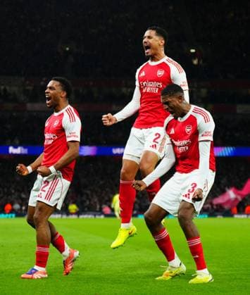 Jurrien Timber of Arsenal celebrates scoring the opening goal with fellow defenders William Saliba and Cristhian Mosquera Arsenal v Bayern Munich, UEFA Champions League, Group Stage, Football, Emirates Stadium, London, UK- 26 Nov 2025London Emirates Stadium United Kingdom EDITORIAL USE ONLY No use with unauthorised audio, video, data, fixture lists, club league logos or live services. Online in-match use limited to 120 images, no video emulation. No use in betting, games or single club league player publications. Copyright: xJavierxGarcia Shutterstockx 15927947bw