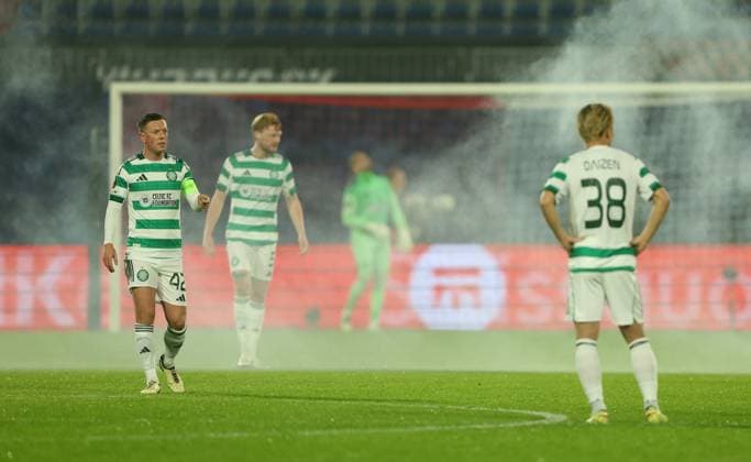 Celtic players look dejected after Feyenoord score the opening goal and fireworks are set off Feyenoord v Celtic, UEFA Europa League, Group Stage, Football, Stadion Feijenoord, Rotterdam, Netherlands - 27 Nov 2025Rotterdam Stadion Feijenoord Netherlands EDITORIAL USE ONLY No use with unauthorised audio, video, data, fixture lists, club league logos or live services. Online in-match use limited to 120 images, no video emulation. No use in betting, games or single club league player publications. Copyright: xKieranxMcManus Shutterstockx 15928065aa
