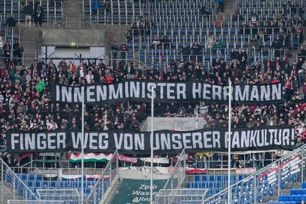 The fans of FC Augsburg show a banner in the fan curve, banner with the inscription Interior Minister Herrmann Finger weg von unserer Fankultur, fans, Ultras audience, spectators, mood, atmosphere, stadium, protest, protest action against Minister of State Joachim Herrmann not in the picture , the Bavarian Minister of the Interior, who will attend the IMK conference of interior ministers in December, where comprehensive security measures for soccer matches could be decided, protest, Action, Action, 29 11 2025, Sinsheim Germany , Football, Bundesliga, TSG 1899 Hoffenheim FC Augsburg, DFB DFL REGULATIONS PROHIBIT ANY USE OF PHOTOGRAPHS AS IMAGE SEQUENCES AND OR QUASI VIDEO xozx