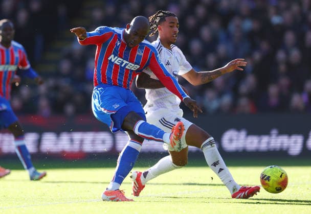 London, England, 30th November 2025. Jean-Philippe Mateta of Crystal Palace under pressure from Leny Yoro of Manchester United, ManU shoots at goal but fails to score during the Crystal Palace vs Manchester United Premier League match at Selhurst Park, London. Picture credit should read: Paul Terry Sportimage EDITORIAL USE ONLY. No use with unauthorised audio, video, data, fixture lists, club league logos or live services. Online in-match use limited to 120 images, no video emulation. No use in betting, games or single club league player publications. SPI_015_PT_Crystal_Palace_Man_Utd SPI-4335-0015