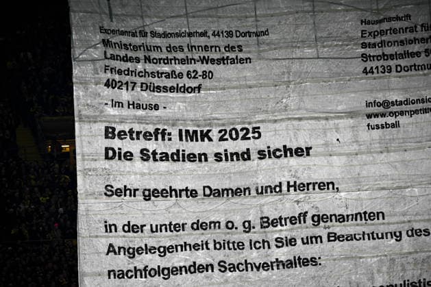 02 12 2025, xjhx, Football DFB Cup Round of 16, Borussia Dortmund Bayer 04 Leverkusen emspor, v l symbol photo, symbol image, symbol fans, spectators, audience, tribute choreo, choreography, choreography IMK Interior Ministers Conference, the stadiums are safe, fan culture DFL DFB REGULATIONS PROHIBIT ANY USE OF PHOTOGRAPHS as IMAGE SEQUENCES and or QUASI VIDEO Dortmund