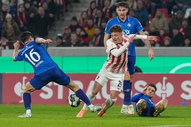 Hiroki Akiyama SV Darmstadt 98, 16 hits Philipp Treu SC Freiburg, 29 in penalty area, penalty kick, foul , Soccer, Round of 16, DFB Pokal, 2025 26, SC Freiburg vs SV Darmstadt 98, 03 12 2025, Europa Park Stadion, Freiburg, Germany DFB REGULATIONS PROHIBIT ANY USE OF PHOTOGRAPHS AS IMAGE SEQUENCES AND OR QUASI VIDEO Freiburg Europa Park Stadion Baden Württemberg Germany Copyright: xArnexAmbergx