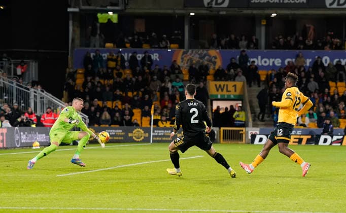 Wolverhampton, England, 8th December 2025. Sam Johnstone of Wolverhampton Wanderers saves a shot from Diogo Dalot of Manchester United, ManU during the Wolverhampton Wanderers vs Manchester United Premier League match at Molineux, Wolverhampton. Picture credit should read: Andrew Yates Sportimage EDITORIAL USE ONLY. No use with unauthorised audio, video, data, fixture lists, club league logos or live services. Online in-match use limited to 120 images, no video emulation. No use in betting, games or single club league player publications. SPI_041_AY_Wolves_Man_Utd SPI-4356-0041