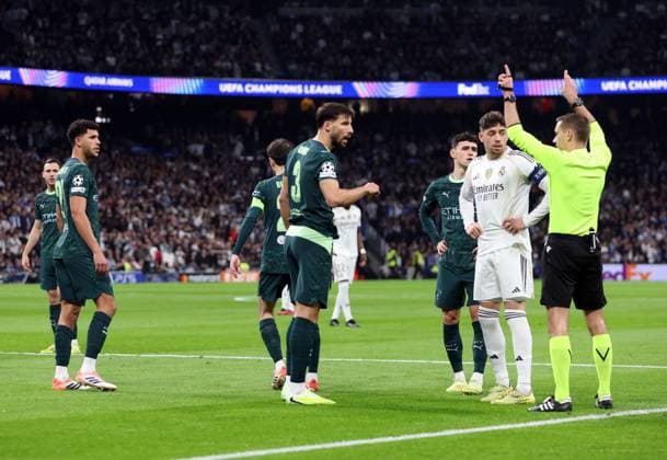 Vinicius Junior of Real Madrid is fouled for a penalty before it is checked by VAR and changed to a free kick Real Madrid v Manchester City, UEFA Champions League, Group Stage, Football, Bernabeu, Madrid, Spain - 10 Dec 2025Madrid Bernabeu Spain EDITORIAL USE ONLY No use with unauthorised audio, video, data, fixture lists, club league logos or live services. Online in-match use limited to 120 images, no video emulation. No use in betting, games or single club league player publications. Copyright: xKieranxMcManus Shutterstockx 16009961m