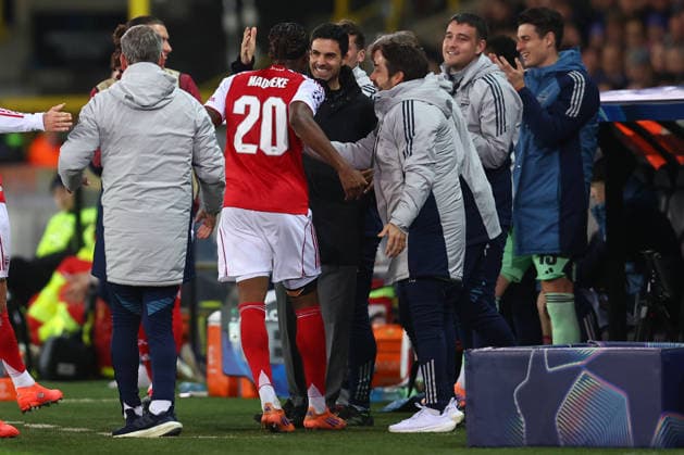 Brugge, Belgium, 10th December 2025. Noni Madueke of Arsenal celebrates with Mikel Arteta, Manager of Arsenal after scoring the opening goal during the Club Brugge vs Arsenal UEFA Champions League match at Jan Breydel Stadium, Brugge. Picture credit should read: Paul Terry Sportimage EDITORIAL USE ONLY. No use with unauthorised audio, video, data, fixture lists, club league logos or live services. Online in-match use limited to 120 images, no video emulation. No use in betting, games or single club league player publications. SPI_033_PT_Brugge_Arsenal SPI-4360-0033