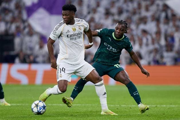 Aurelien Tchouameni of Real Madrid CF and Jeremy Doku of Manchester City FC Real Madrid v Manchester City, UEFA Champions League, Football, Estadio Santiago Bernabeu, Madrid, Spain - 10 Dec 2025Madrid Estadio Santiago Bernabu Spain EDITORIAL USE ONLY No use with unauthorised audio, video, data, fixture lists, club league logos or live services. Online in-match use limited to 120 images, no video emulation. No use in betting, games or single club league player publications. Copyright: xRubenxAlbarran Shutterstockx 16073023bt