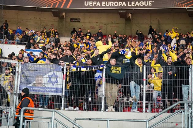 Football UEFA Europa League 2025 26, Matchday 6 VfB Stuttgart vs Maccabi Tel Aviv FC Arena Stuttgart Germany Stuttgart, Germany, Europe, Maccabi guest block, fans in yellow blue, Israel flags, fence flags, Maccabi Fanatics scene, away mob, stadium atmosphere, security situation, UEFA Europa League, fan culture, international match, symbolic photo current European Cup atmosphere Copyright: xJOERANxSTEINSIEKx