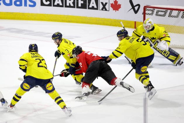 December 20, 2025, London, On, Canada: Sweden forward Liam Danielsson (23), defenceman Felix Ohrqvist (3) and defenceman Sascha Boumedienne (5) defend against Canada forward Porter Martone (22) during the third period of a IIHF World Junior Hockey Championship pre-tournament game in London, Ont., Saturday, December 20, 2025. Canada News - December 20, 2025 - ZUMAc35_ 20251220_zaf_c35_089 Copyright: xNicolexOsbornex