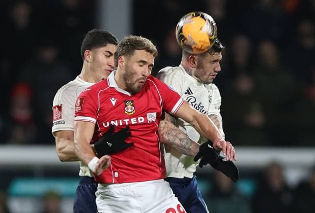 Sam Smith of Wrexham challenges Morato of Nottingham Forest Wrexham v Nottingham Forest, Emirates FA Cup, Third Round, Football, SToK Cae Ras, Wrexham, UK - 09 Jan 2026Wrexham SToK Cae Ras United Kingdom EDITORIAL USE ONLY No use with unauthorised audio, video, data, fixture lists, club league logos or live services. Online in-match use limited to 120 images, no video emulation. No use in betting, games or single club league player publications. Copyright: xKieranxMcManus Shutterstockx 16233000ag