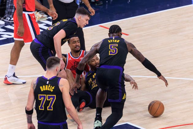 January 22, 2026, Inglewood, California, USA: Marcus Smart 36, Jake LaRavia 12 and Deandre Ayton 5 of the Los Angeles Lakers attempts to wrestle the ball from John Collins 20 of the Los Angeles Clippers during their regular season NBA, Basketball Herren, USA game on Thursday January 22, 2026 at Intuit Dome in Inglewood, California. Clippers defeat Lakers, 112-104. ARIANA RUIZ PI Inglewood USA - ZUMAp124 20260122_zaa_p124_043 Copyright: xArianaxRuizx