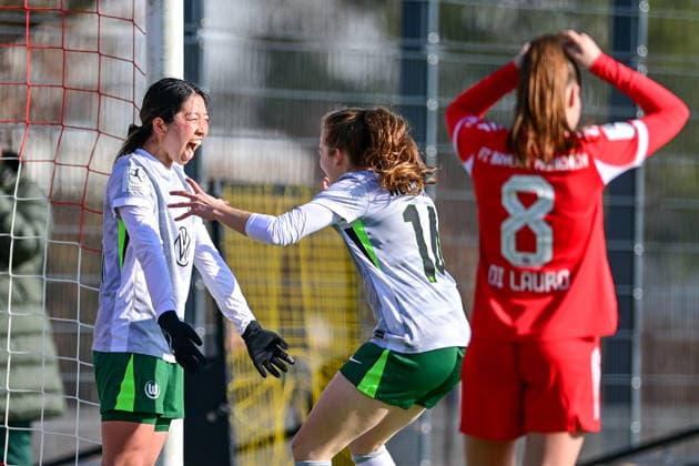 from left goalkeeper Hitomi Yamaue Wolfsburg, 23 and Elena Goessler Wolfsburg, 14 with goal celebration, jubilation, goal celebration, celebrate the goal, goal, celebration, jubilation over the goal to 1 2, optimistic, action, action, Samira Di Lauro FCB, 8 looking disappointed, disappointment, frustration, disappointed, pessimistic, 08 02 2026, Munich Germany , Soccer,2 Women Bundesliga, FC Bayern München II VfL Wolfsburg II, DFB DFL REGULATIONS PROHIBIT ANY USE OF PHOTOGRAPHS AS IMAGE SEQUENCES AND OR QUASI VIDEO xslx