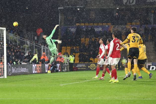 Hugo Bueno of Wolverhampton Wanderers (out of picture) scores past David Raya of Arsenal to make it 1-2 Wolverhampton Wanderers v Arsenal, Premier League, Football, Molineux, Wolverhampton, UK - 18 Feb 2026Wolverhampton Molineux United Kingdom EDITORIAL USE ONLY No use with unauthorised audio, video, data, fixture lists, club league logos or live services. Online in-match use limited to 120 images, no video emulation. No use in betting, games or single club league player publications. Copyright: xRyanxBrowne Shutterstockx 16660426cz
