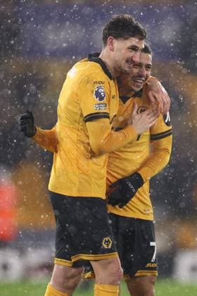 Santiago Bueno of Wolverhampton Wanderers and Andre at the end of the match Wolverhampton Wanderers v Arsenal, Premier League, Football, Molineux, Wolverhampton, UK - 18 Feb 2026Wolverhampton Molineux United Kingdom EDITORIAL USE ONLY No use with unauthorised audio, video, data, fixture lists, club league logos or live services. Online in-match use limited to 120 images, no video emulation. No use in betting, games or single club league player publications. Copyright: xRyanxBrowne Shutterstockx 16660426ff