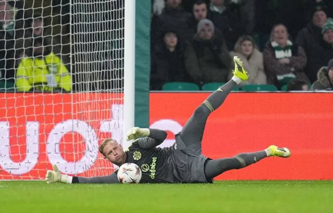 Celtic goalkeeper Kasper Schmeichel dives to stop an own-goal from a poor touch by Liam Scales of Celtic. Celtic v Stuttgart, UEFA Europa League, Knockout Round Play Offs, First Leg, Football, Celtic Park, Glasgow, Scotland, UK - 19 Feb 2026Glasgow Celtic Park Scotland United Kingdom EDITORIAL USE ONLY No use with unauthorised audio, video, data, fixture lists, club league logos or live services. Online in-match use limited to 120 images, no video emulation. No use in betting, games or single club league player publications. Copyright: xStuartxWallace Shutterstockx 16674319bf
