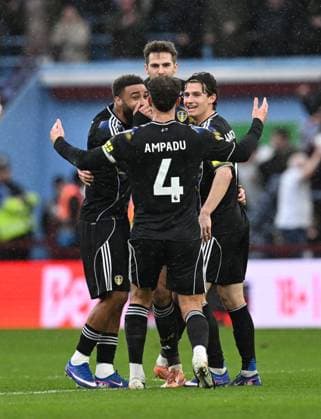 Anton Stach of Leeds United celebrates with team mates after scoring the team s first goal Aston Villa v Leeds United, Premier League, Football, Villa Park, Birmingham, UK - 21 Feb 2026Birmingham Villa Park United Kingdom EDITORIAL USE ONLY No use with unauthorised audio, video, data, fixture lists, club league logos or live services. Online in-match use limited to 120 images, no video emulation. No use in betting, games or single club league player publications. Copyright: xAnnaxGowthorpe Shutterstockx 16681467o
