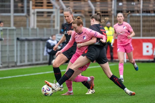 Duel between Nikee van Dijk TSG Hoffenheim, 25 and Lilla Turanyi Bayer 04 Leverkusen, 24 Juliette Vidal Bayer 04 Leverkusen, 56 Bayer 04 Leverkusen vs TSG 1899 Hoffenheim, Football, Womens Bundesliga, Matchday 19, Season 2025 2026, 22 02 2026 DFL DFB Regulations prohibit any use of Photographs as image sequences and or Quasivideo Bayer 04 Leverkusen vs TSG 1899 Hoffenheim , Football, Womens Bundesliga, Matchday 19, Season 2025 2026, 22 02 2026 Leverkusen Copyright: xEibner-Pressefoto ThomasxHaeslerx EP_THR