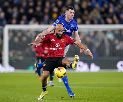 Liverpool, England, 23rd February 2026. James Tarkowski of Everton challenges Bryan Mbeumo of Manchester United, ManU during the Everton vs Manchester United Premier League match at Hill Dickinson Stadium, Liverpool. Picture credit should read: Andrew Yates Sportimage EDITORIAL USE ONLY. No use with unauthorised audio, video, data, fixture lists, club league logos or live services. Online in-match use limited to 120 images, no video emulation. No use in betting, games or single club league player publications. SPI_040_AY_Everton_Man_Utd SPI-4547-0040