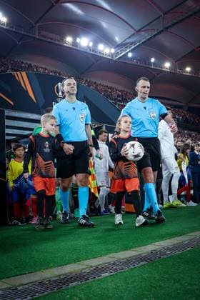 Referee Irfan Peljto BIH , right, leads the two teams onto the field, VfB Stuttgart vs Celtic Glasgow FC, Football, Men, UEFA Europa League, Season 2025 2026, Play off, Round 2 of 2, 26 02 2026 Stuttgart Baden Wuerttemberg Germany Copyright: xkolbert-press MartinxAgüerax