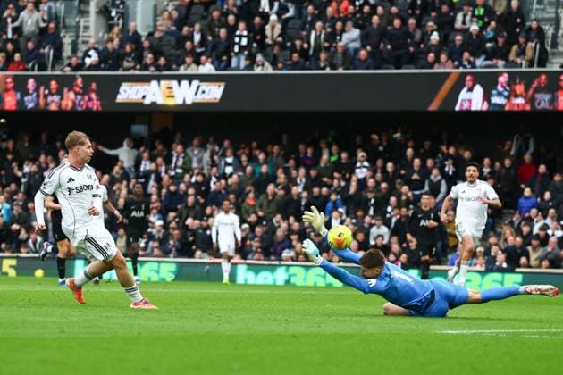 Emile Smith Rowe of Fulham with a shot on goal saved by Guglielmo Vicario of Tottenham Hotspur Fulham v Tottenham Hotspur, Premier League, Football, Craven Cottage, London, UK - 01 Mar 2026London Craven Cottage United Kingdom EDITORIAL USE ONLY No use with unauthorised audio, video, data, fixture lists, club league logos or live services. Online in-match use limited to 120 images, no video emulation. No use in betting, games or single club league player publications. Copyright: xSimonxDael Shutterstockx 16708827bl