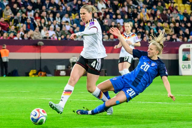 In the picture, from left Camilla Kuever Germany , Zara Kramžar, Action, duels, fighting for the ball, GER, Dresden, World Cup Qualification, Women, Germany vs Slovenia, at Rudolf Harbig Stadium Dresden, League A, Group A4, soccer, DFB, league phase, match day 1, DFB DFL REGULATIONS PROHIBIT ANY USE OF PHOTOGRAPHS AS IMAGE SEQUENCES AND OR QUASI VIDEO, March 3, 2026 Copyright: HMBxMedia UwexKoch
