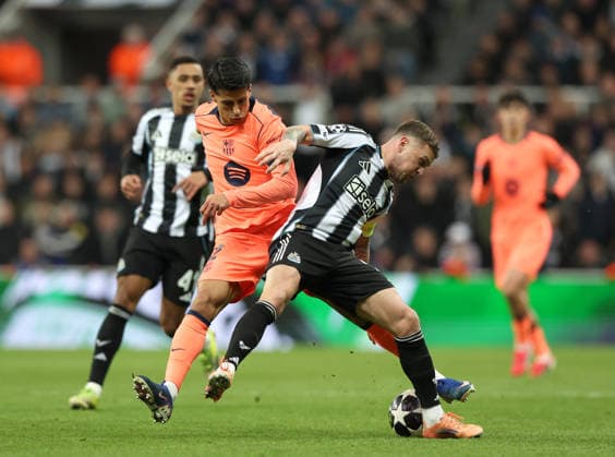 Newcastle Upon Tyne, England, 10th March 2026. Joao Cancelo of FC Barcelona, Barca tackles Kieran Trippier of Newcastle United during the Newcastle United vs FC Barcelona UEFA Champions League match at St. James Park, Newcastle Upon Tyne. Picture credit should read: Nigel Roddis Sportimage EDITORIAL USE ONLY. No use with unauthorised audio, video, data, fixture lists, club league logos or live services. Online in-match use limited to 120 images, no video emulation. No use in betting, games or single club league player publications. SPI_042_NR_NEWC_BARCx SPI-4596-0042
