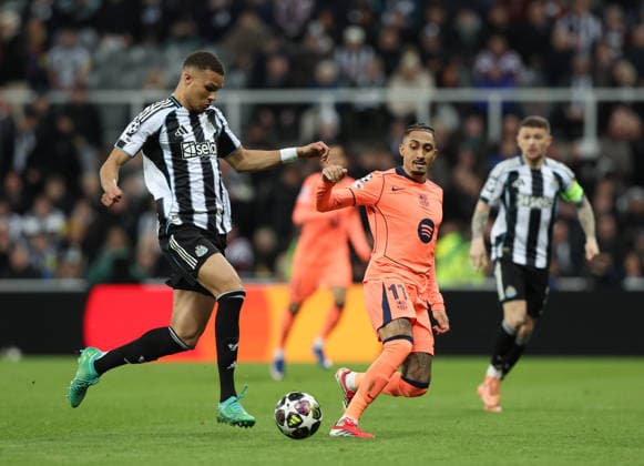 Newcastle Upon Tyne, England, 10th March 2026. Malick Thiaw of Newcastle United tussles with Raphinha of FC Barcelona, Barca during the Newcastle United vs FC Barcelona UEFA Champions League match at St. James Park, Newcastle Upon Tyne. Picture credit should read: Nigel Roddis Sportimage EDITORIAL USE ONLY. No use with unauthorised audio, video, data, fixture lists, club league logos or live services. Online in-match use limited to 120 images, no video emulation. No use in betting, games or single club league player publications. SPI_044_NR_NEWC_BARCx SPI-4596-0044