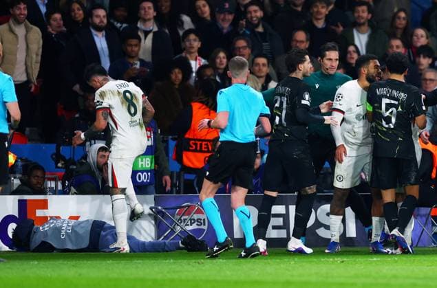 A clash breaks out between both sides as a ball assistant is seen on the floor. Paris Saint-Germain v Chelsea, UEFA Champions League, Round of 16, First Leg, Football, Parc des Princes, Paris, France - 11 Mar 2026Paris Parc des Princes France EDITORIAL USE ONLY No use with unauthorised audio, video, data, fixture lists, club league logos or live services. Online in-match use limited to 120 images, no video emulation. No use in betting, games or single club league player publications. Copyright: xJamesxMarsh Shutterstockx 16746728dx
