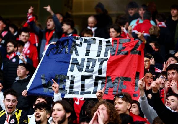 A banner is held up by Lille fans aimed at Emiliano Martinez of Aston Villa. Lille v Aston Villa, UEFA Europa League, Round of 16, First Leg, Football, Stade Pierre-Mauroy, Lille, France - 12 Mar 2026Lille Stade Pierre-Mauroy France EDITORIAL USE ONLY No use with unauthorised audio, video, data, fixture lists, club league logos or live services. Online in-match use limited to 120 images, no video emulation. No use in betting, games or single club league player publications. Copyright: xJamesxMarsh Shutterstockx 16746748ac
