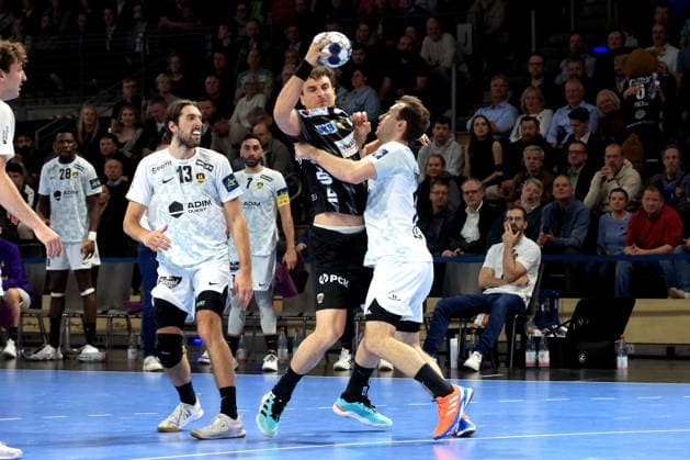 DEU, Machineseeker EHF Champions League, Fuechse Berlin vs HBC Nantes, 12 03 2026, Max Schmeling Halle, Berlin, DEU, Machineseeker EHF Champions League, Fuechse Berlin vs HBC Nantes, in the picture Lukas Herburger Fuechse Berlin 29 , Julien Bos HBC Nantes 13 , Kauldi Odriozola Yeregui HBC Nantes 19 nordphotoxGmbHx xEngler nph00076