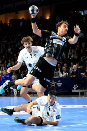 DEU, Machineseeker EHF Champions League, Fuechse Berlin vs HBC Nantes, 12 03 2026, Max Schmeling Halle, Berlin, DEU, Machineseeker EHF Champions League, Fuechse Berlin vs HBC Nantes, in the picture Lukas Herburger Fuechse Berlin 29 , Shuichi Yoshida HBC Nantes 5 , Thibaud Briet HBC Nantes 3 nordphotoxGmbHx xEngler nph00076