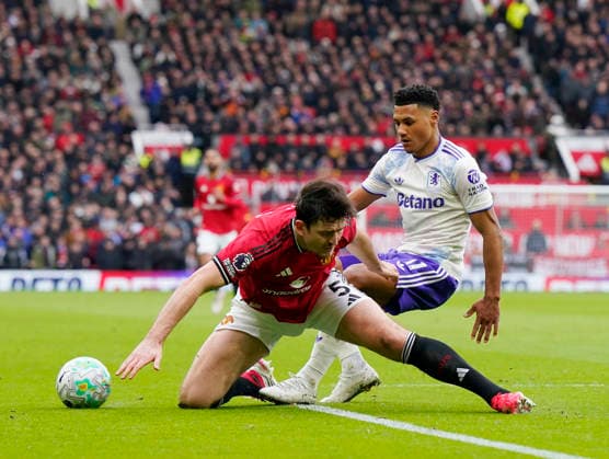 Manchester, England, 15th March 2026. Harry Maguire of Manchester United, ManU (l) and Ollie Watkins of Aston Villa (r) during the Manchester United vs Aston Villa Premier League match at Old Trafford, Manchester. Picture credit should read: Andrew Yates Sportimage EDITORIAL USE ONLY. No use with unauthorised audio, video, data, fixture lists, club league logos or live services. Online in-match use limited to 120 images, no video emulation. No use in betting, games or single club league player publications. SPI_029_AY_Man_Utd_Villa SPI-4605-0028