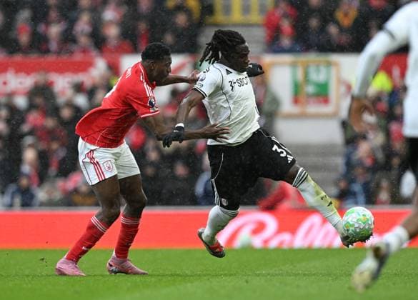 Taiwo Awoniyi of Nottingham Forest and Calvin Bassey of Fulham Nottingham Forest v Fulham, Premier League, Football, City Ground, Nottingham, UK - 15 Mar 2026Nottingham City Ground United Kingdom EDITORIAL USE ONLY No use with unauthorised audio, video, data, fixture lists, club league logos or live services. Online in-match use limited to 120 images, no video emulation. No use in betting, games or single club league player publications. Copyright: xAnnaxGowthorpe Shutterstockx 16757313au