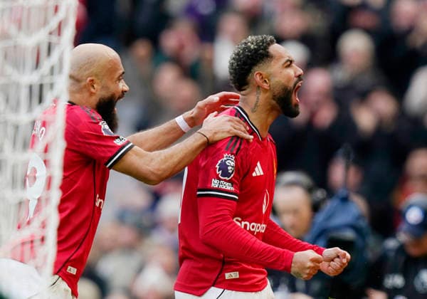 Manchester, England, 15th March 2026. Matheus Cunha of Manchester United, ManU (r) celebrates scoring their second goal during the Manchester United vs Aston Villa Premier League match at Old Trafford, Manchester. Picture credit should read: Andrew Yates Sportimage EDITORIAL USE ONLY. No use with unauthorised audio, video, data, fixture lists, club league logos or live services. Online in-match use limited to 120 images, no video emulation. No use in betting, games or single club league player publications. SPI_070_AY_Man_Utd_Villa SPI-4605-0070
