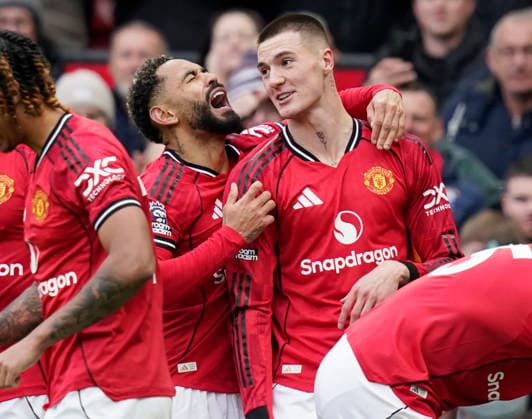 Manchester, England, 15th March 2026. Matheus Cunha of Manchester United, ManU celebrates with third goal scorer Benjamin Sesko of Manchester United during the Manchester United vs Aston Villa Premier League match at Old Trafford, Manchester. Picture credit should read: Andrew Yates Sportimage EDITORIAL USE ONLY. No use with unauthorised audio, video, data, fixture lists, club league logos or live services. Online in-match use limited to 120 images, no video emulation. No use in betting, games or single club league player publications. SPI_075_AY_Man_Utd_Villa SPI-4605-0076