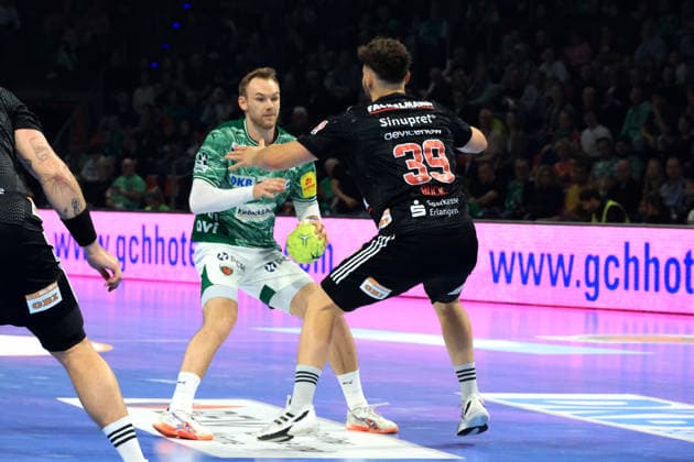 DEU, DHB, 1 HBL, Fuechse Berlin vs Erlangen, 15 03 2026, Max Schmeling Halle, Berlin, DEU, DHB, 1 HBL, Fuechse Berlin vs Erlangen, in the picture Mathias Gidsel Fuechse Berlin 19 , Tobias Buck Erlangen 39 nordphotoxGmbHx xEngler nph00076