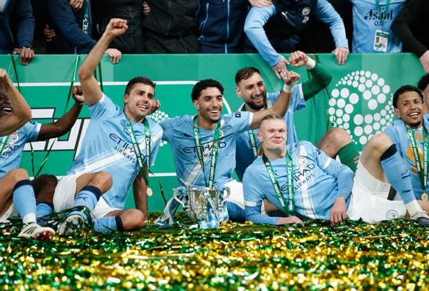 Manchester City players celebrate with the League Cup Arsenal v Manchester City, Football, Carabao Cup Final, Wembley Stadium, Wembley, London - UK, 22 03 2026 EDITORIAL USE ONLY No use with unauthorised audio, video, data, fixture lists (outside the EU), club league logos or live services. Online in-match use limited to 45 images (+15 in extra time). No use to emulate moving images. No use in betting, games or Copyright: xMattxImpey Shutterstockx 16786067s