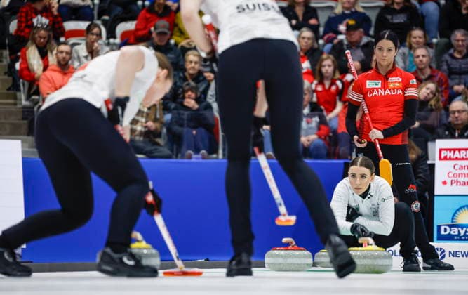 March 22, 2026, Calgary, Ab, CANADA: Switzerland s skip Xenia Schwaller, second right, watches a shot as Team Canada skip Kerri Einarson looks on during the gold medal draw at the World Women™s Curling Championship in Calgary, Sunday, March 22, 2026. Xenia Schwaller, Kerri Einarson - ZUMAc35_ 20260322_zaf_c35_015 Copyright: xJeffxMcintoshx