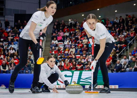 March 22, 2026, Calgary, Ab, CANADA: Switzerland s skip Xenia Schwaller, centre, delivers a stone against Team Canada as lead Selina Rychiger, left, and third Selina Gafner sweep during the gold medal draw at the World WomenöÄÃ s Curling Championship in Calgary, Sunday, March 22, 2026. Selina Rychiger, Selina Gafner, Xenia Schwaller - ZUMAc35_ 20260322_zaf_c35_030 Copyright: xJeffxMcintoshx