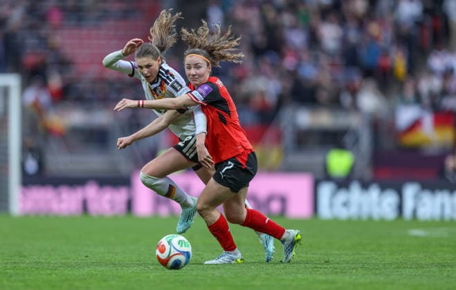 GER, Nuremberg, Germany vs Austria, International match, Football, FIFA, 2026 2027 season, World Cup Qualification, Max Morlock Stadium, 3 Matchday in picture f l Jule Brand Germany Women 22 , Melanie Brunnthaler Austria 7 DFB DFL REGULATIONS PROHIBIT ANY USE OF PHOTOGRAPHS AS IMAGE SEQUENCES AND OR QUASI VIDEO, 14 04 2026 Copyright: HMBxMedia HendrikxHamelau