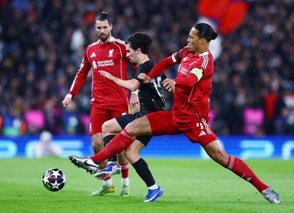 Vitinha of Paris Saint Germain and Virgil van Dijk of Liverpool Liverpool v Paris Saint-Germain, UEFA Champions League, Quarter Final, Second Leg, Football, Anfield, Liverpool, UK - 14 Apr 2026Liverpool Anfield France EDITORIAL USE ONLY No use with unauthorised audio, video, data, fixture lists, club league logos or live services. Online in-match use limited to 120 images, no video emulation. No use in betting, games or single club league player publications. Copyright: xMattxWest Shutterstockx 16828520ag