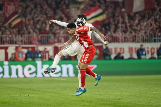 GER, Bavaria, Munich, Fussball, FC Bayern Munich - Real Madrid CF, at the Allianz Arena, Munich, Champions League, Quarter finals, second leg, April 15, 2026, from left: Federico Valverde (Real Madrid CF, 8), Luis Diaz (FC Bayern Muenchen, 14), header duel in the air, Kopfball duell in der Luft UEFA regulations prohibit any use of photographs as image sequences and or quasi-video, Munich Allianz Arena Bavaria Germany Copyright: xMichaelxNibelx