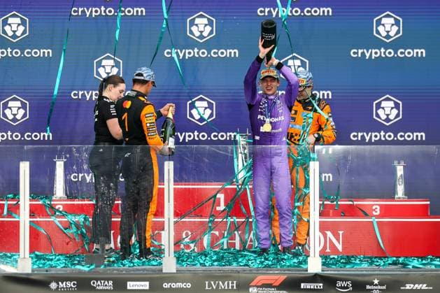 Champagne shower between 2nd place Lando Norris McLaren Formula 1 Team , Winner, Winner, Kimi Antonelli Mercedes AMG Petronas 12 , 3rd place Oscar Piastri McLaren Formula 1 Team 81 , Amy Walker Mercedes AMG Petronas , Grand Prix of Miami, Motorsport, Men, Formula 1, Race, 03 05 2026 Miami Florida USA Copyright: xkolbert-press ChristianxKolbertx