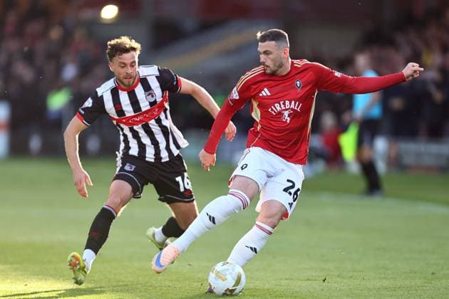 Reece Staunton of Grimsby and Ryan Graydon of Salford City Salford City v Grimsby Town, EFL Sky Bet League Two, Play-Off Semi Final, Second Leg, Football, Peninsula Stadium, Salford, UK - 15 May 2026Salford Peninsula Stadium United Kingdom EDITORIAL USE ONLY No use with unauthorised audio, video, data, fixture lists, club league logos or live services. Online in-match use limited to 120 images, no video emulation. No use in betting, games or single club league player publications. Copyright: xPhilxOldham Shutterstockx 16876824s