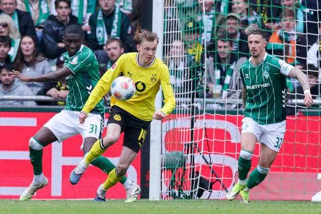 Karim Coulibaly Werder Bremen , Maximilian Beier Borussia Dortmund and Marco Friedl Werder Bremen battle for the ball, Bundesliga, SV Werder Bremen v Borussia Dortmund, Weserstadion, May 16, 2026 in Bremen, Germany Photo by Marco Steinbrenner DeFodi Images Karim Coulibaly Werder Bremen , Maximilian Beier Borussia Dortmund and Marco Friedl Werder Bremen Werder Bremen battle for the ball, Bundesliga, SV Werder Bremen v Borussia Dortmund, Weserstadion, May 16, 2026 in Bremen, Germany Photo by Marco Steinbrenner DeFodi Images DFL regulations prohibit any use of photographs as image sequences and or quasi video
