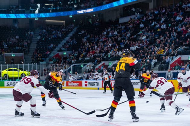 ZURICH, SWITZERLAND - MAY 17: Lukas Reichel (Germany, 73) trying to score against Filips Buncis (Latvia, 89) and Haralds Egle (Latvia, 97)during the Preliminary Round - Group A Match 15 between Germany and Latvia at the IIHF Ice hockey, Eishockey World Championship, WM, Weltmeisterschaft 2026, Swiss Life Arena on May 17, 2026 in Zurich, Switzerland. Zurich Switzerland Copyright: xTimoxSteinx